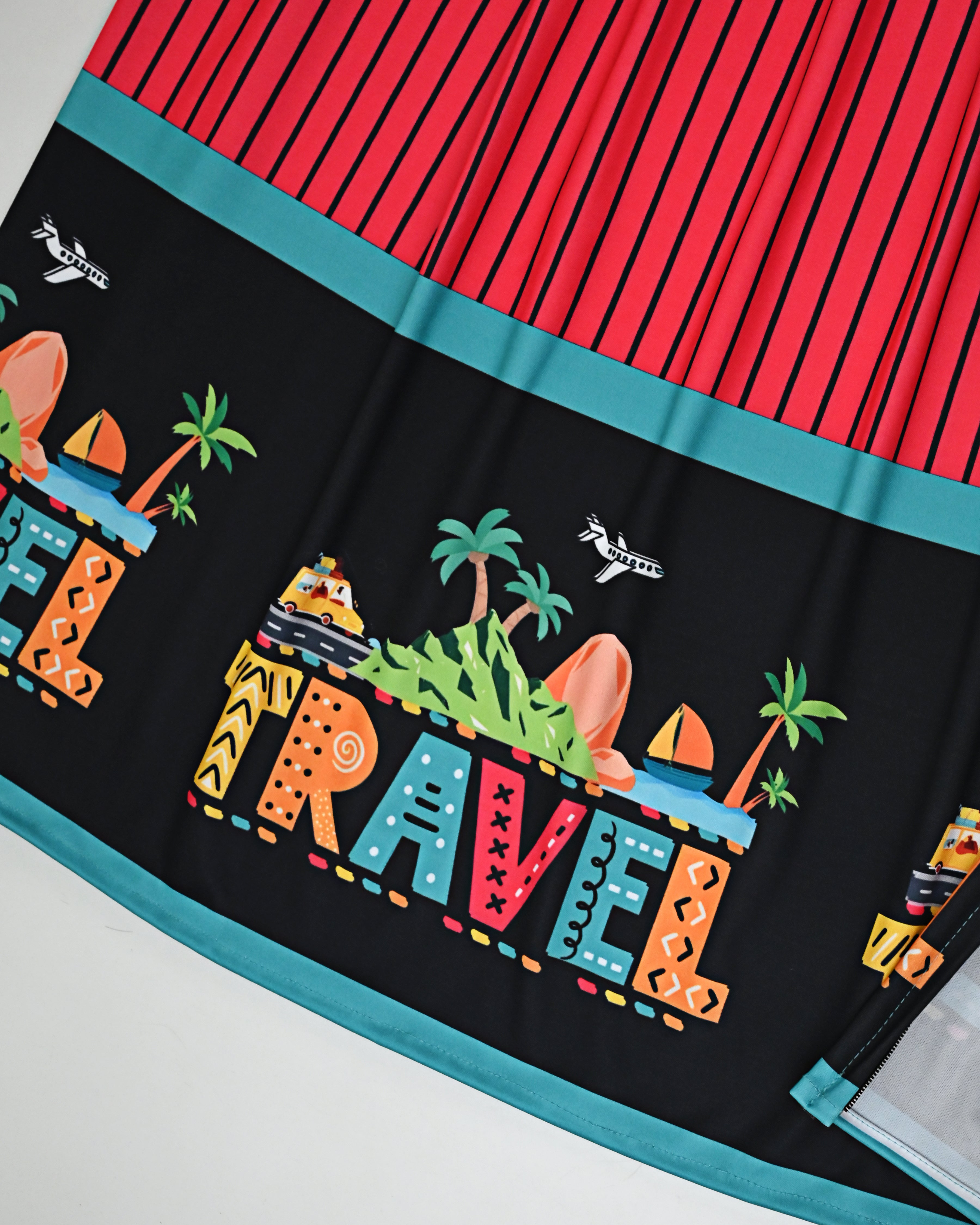 Dark Orange Black Stripes Swim Wear With Travel Printed Objects On Black Base-